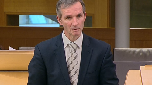 McArthur speaking in chamber