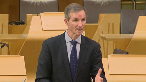 McArthur speaking in chamber