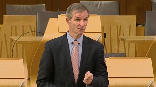 McArthur speaking in chamber