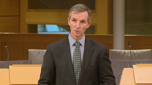 McArthur speaking in chamber